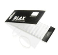 En förpackning med BLAX Hair Elastics - Clear (8 st) från BLAX visar flera flexibla, genomskinliga hårband ordnade i en rad, med några elastiska band tagna ut och placerade bredvid förpackningen.