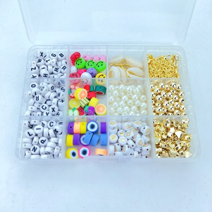 The Fashiongirl Clay Beads / Heishi Beads Arona Kit is a KREA DIY Jewellery Kit with 12,000 assorted beads, including letters, colorful rounds, pearls, fruit slice beads, metallic gold beads, and gold clasps in a 12-compartment organizer box.