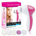 Fashiongirl Facial Brush 5-in-1 | Facial Brush Cleanser visas bredvid sin förpackning, som visar en kvinnas ansikte och produktbilder. Fem utbytbara borstar och dynor är placerade framför för din hudvårdsrutin.