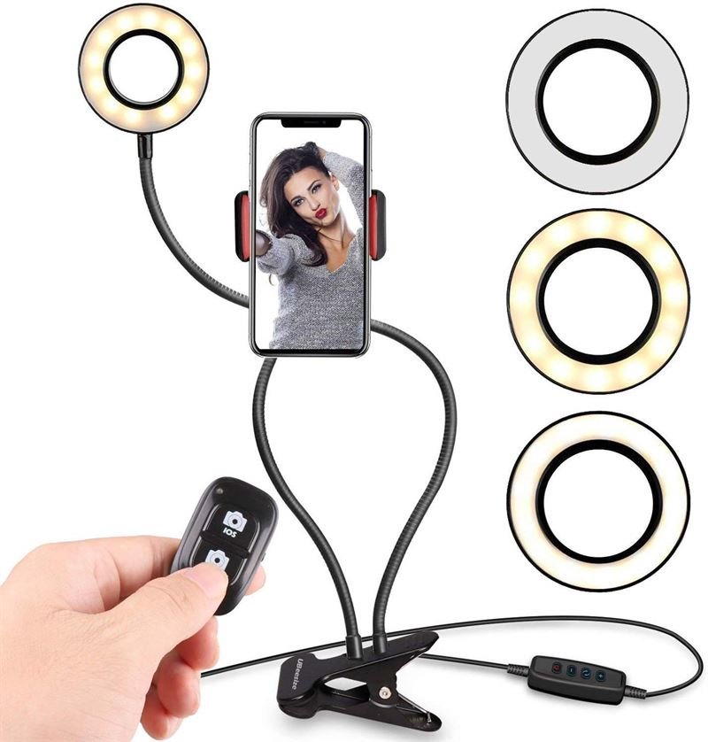 UNIQ Selfie Ring Light har justerbar LED-ljusstyrka, flexibla armar, en fjärrkontroll, en clip-on-bas och kabelkontroller – perfekt för streaming, vloggar, YouTube eller smink – med tre färglägen: vitt, varmt och neutralt.