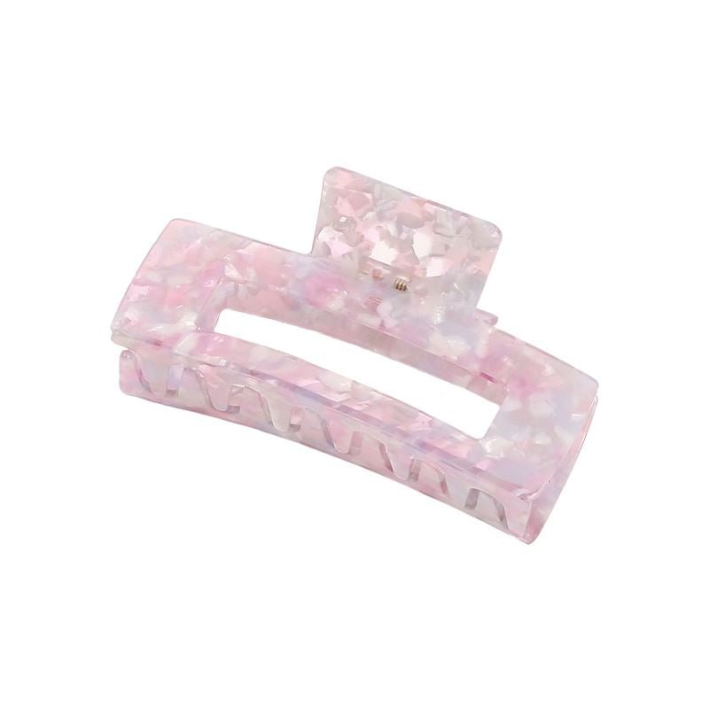 The SOHO Clara Hair Claw - Lavender Pink is a large rectangular acrylic clip in pink and white marble with a glossy, translucent finish and spring hinge—ideal as an XL hair accessory for thick hair.