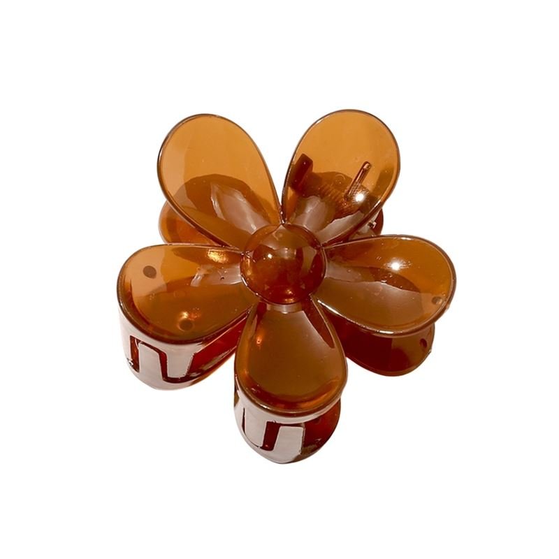 The SOHO Fiore Hair Claw - Russet by SOHO is a stylish, brown translucent hair accessory shaped like a six-petal flower, shown from above.