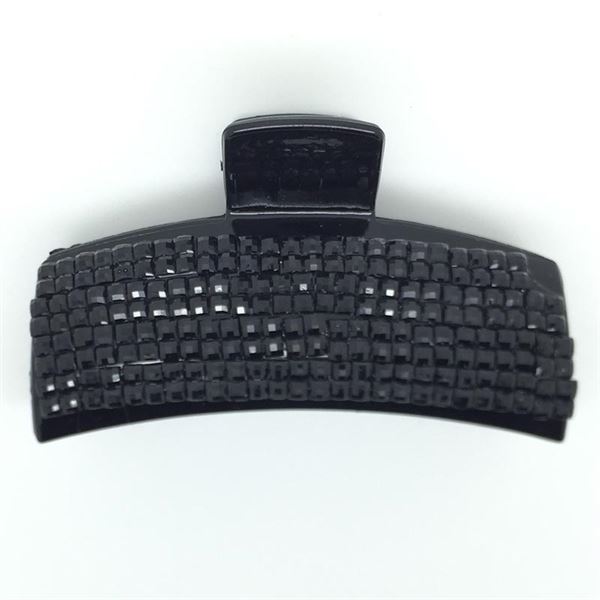 The SOHO Hair Claw by SOHO is a black plastic hair accessory with a rectangular, grid-textured clasp, displayed on a plain white background.