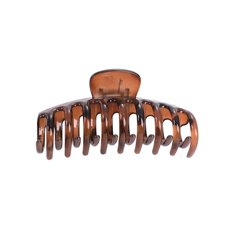The SOHO Kana Hair Claw - Tortoise is a large brown plastic clip by SOHO with curved prongs and a spring hinge, offering a strong grip for all hair types and keeping your hair secure and in place.