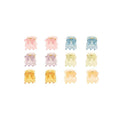 SOHO Lucca Mini Hair Claws - Glitter finns i pastellfärger – rosa, lila, gult, grönt och blått – ordnade i rader. Dessa fina SOHO-klämmor ger en charmig glans till alla frisyrer.