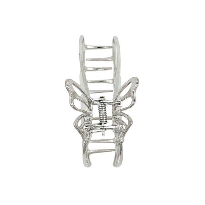 The SOHO Nabi Hair Claw - Silver by SOHO is a metal butterfly hair clip with openwork wings and a spring mechanism—ideal for adding elegant hold to your updo.