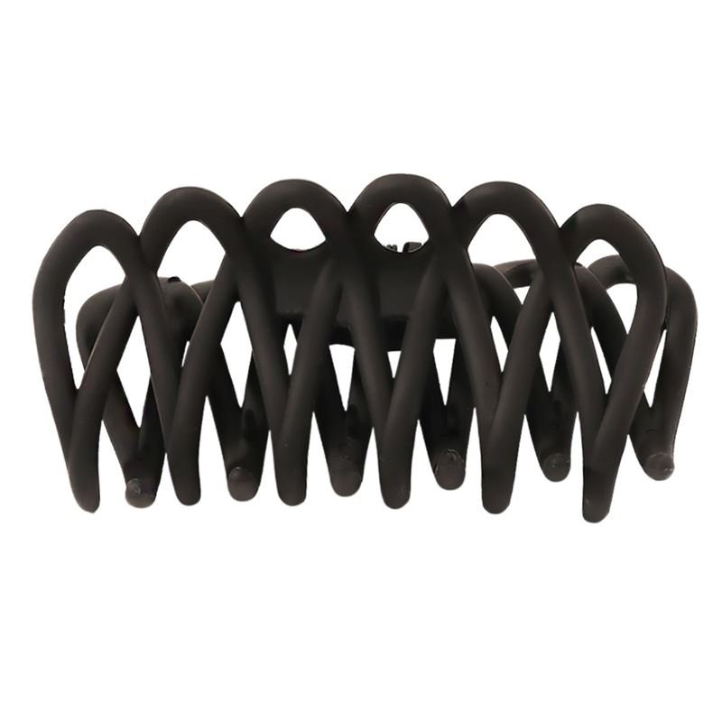 The SOHO Olive Hair Claw - Black by SOHO features interlocking curved prongs for a gentle grip, ideal for all hair types. Matte black finish. Pictured from the side against a white background.