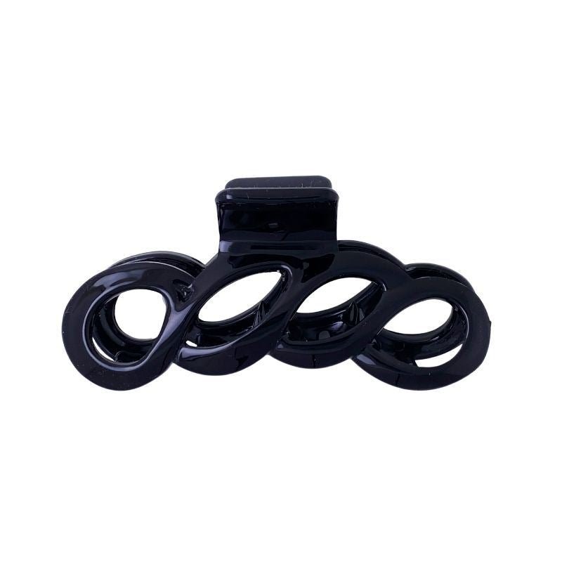 The SOHO Wave Hair Claw - Black by SOHO features an open, swirled loop design and a spring-loaded clasp for a strong grip and secure styling.