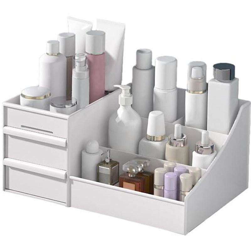 The UNIQ Cosmetic Organiser with Two Drawers in white neatly stores skincare and cosmetic bottles, jars, and tubes in multiple compartments, with two small drawers on the left side.