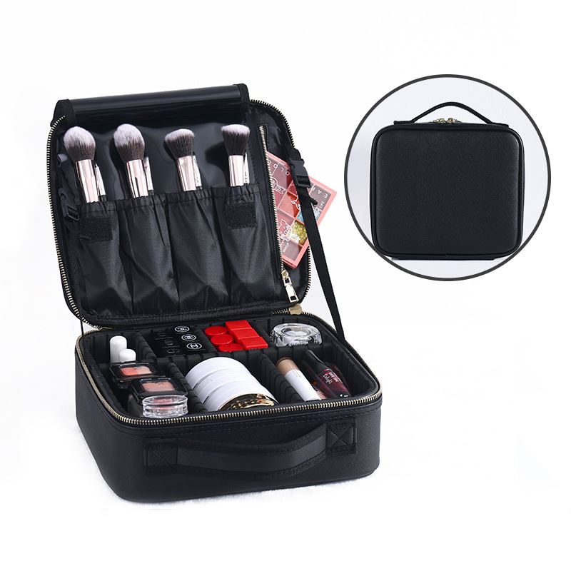 The UNIQ makeup travel bag by UNIQ is a black cosmetic and toiletry case with adjustable compartments, neatly organizing brushes and cosmetics. Shown open to display makeup items, plus a smaller image reveals the sturdy handled closed bag.