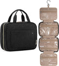 UNIQ Travel Toiletry Bag i svart har fyra vattentäta fack, en upphängningskrok och handtag. Denna organizer från UNIQ visas stängd och öppen, vilket avslöjar dess transparenta fack med dragkedja – perfekt för resor.