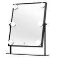 UNIQ XL Hollywood Mirror med LED-belysning och touchkontroll från UNIQ har en elegant svart ram, sex runda LED-lampor och en touch-knapp. Den har ett stabilt stativ, vilket gör den perfekt för din sminkrutin.